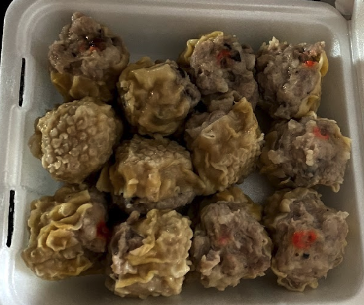 Assorted dim sum including baked char siu bao and egg tarts